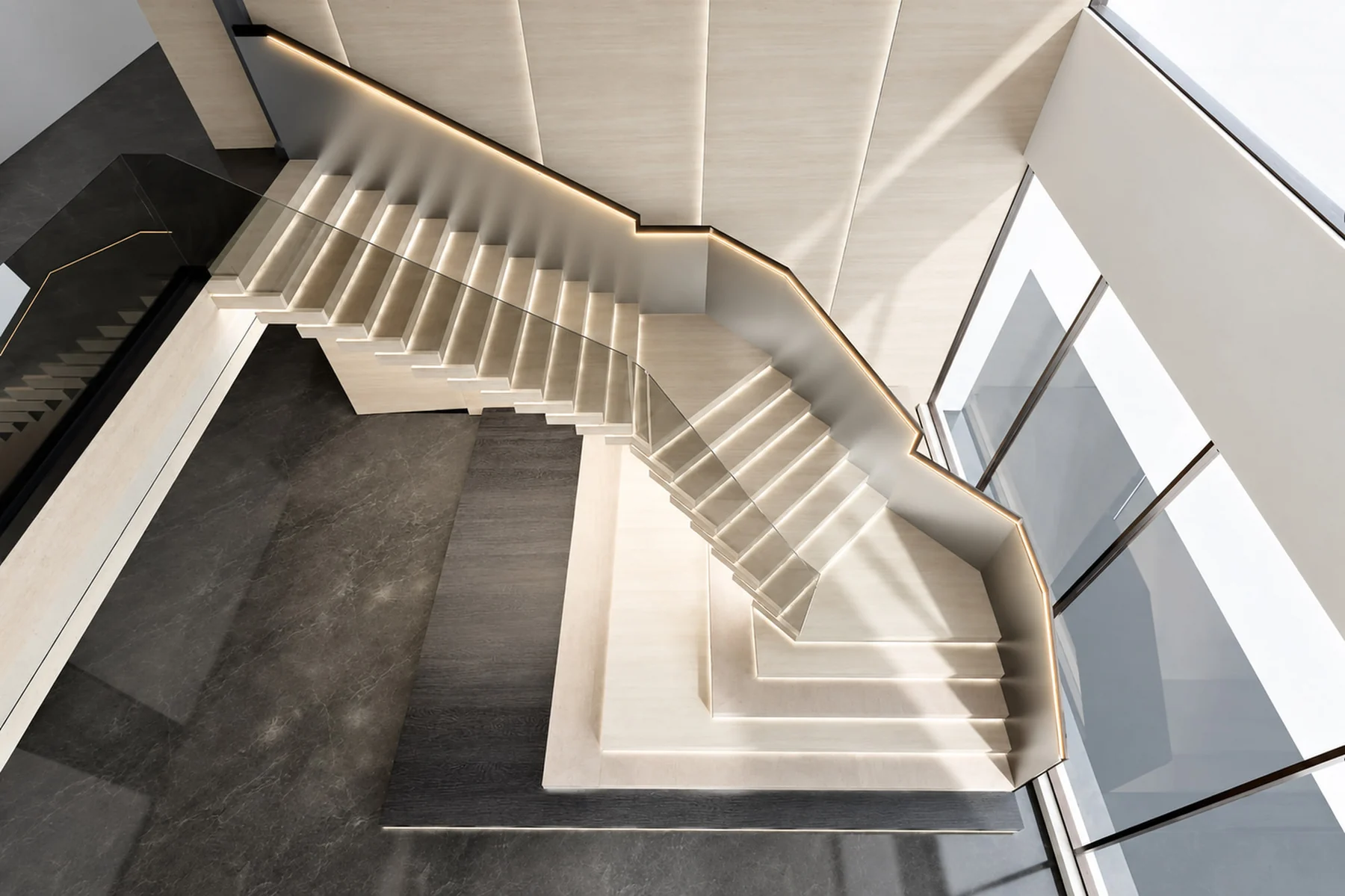 White folded steps with a floating appearance and dark steel support in a staircase in Shantou, China.